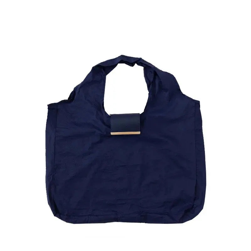 The Tiny Keychain Tote That Opens Into a Full-Size Shopping Bag